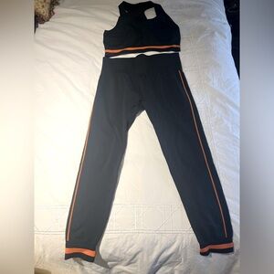 The Upside matching set in navy blue and orange.size Large